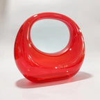 crescent acrylic clutch